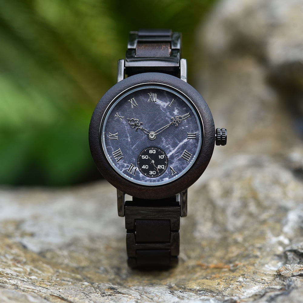 Elegant Mokozai wooden wristwatch featuring a black marble dial with Roman numerals and ornate hands, complemented by a small second subdial. The dark wood frame and metal band create a bold, timeless look perfect for style-conscious Australians.