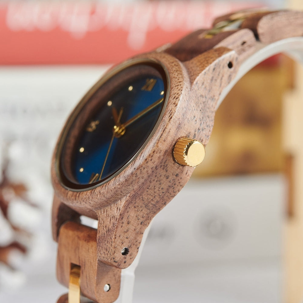 Close-up of a Mokozai wooden wristwatch showcasing its natural walnut wood casing and a sleek gold crown. The deep blue dial adds an elegant contrast, emphasizing the luxurious design for style-conscious individuals in Australia.