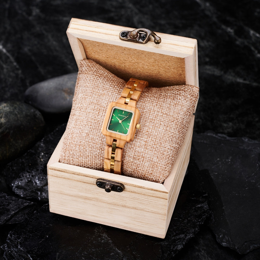 Mokozaiโs handcrafted wooden watch with a green dial elegantly displayed in a wooden box, embodying sustainable luxuryโan eco-conscious choice for those in Australia seeking unique and stylish accessories.