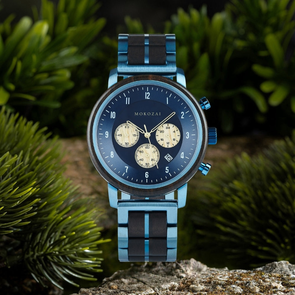Mokozai men's chronograph watch with a bold blue and black metal strap and a blue dial. The dial features three golden subdials for added functionality. The eco-friendly design combines natural wood accents with a modern metallic finish, perfect for stylish men looking for a unique statement piece in Australia.