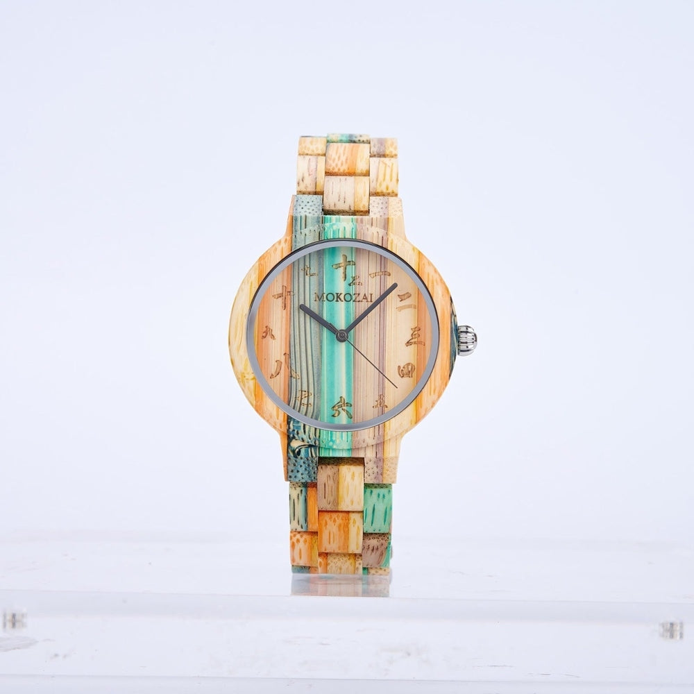 Mokozai wooden wristwatch featuring a multicolored bamboo design with shades of teal, orange, and natural wood tones. The dial displays elegant Asian-inspired numerals and minimalist black watch hands, creating a unique fusion of cultural and eco-friendly style. Ideal for fashion-forward, eco-conscious individuals in Australia.