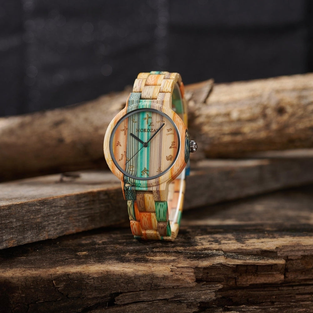 Front view of a Mokozai bamboo wristwatch with a striking multicolored design, featuring vibrant shades of teal, orange, and natural bamboo tones. The watch face showcases minimalist markings and a sleek silver bezel, reflecting eco-friendly craftsmanship and unique style. Ideal for fashion-forward nature lovers in Australia.